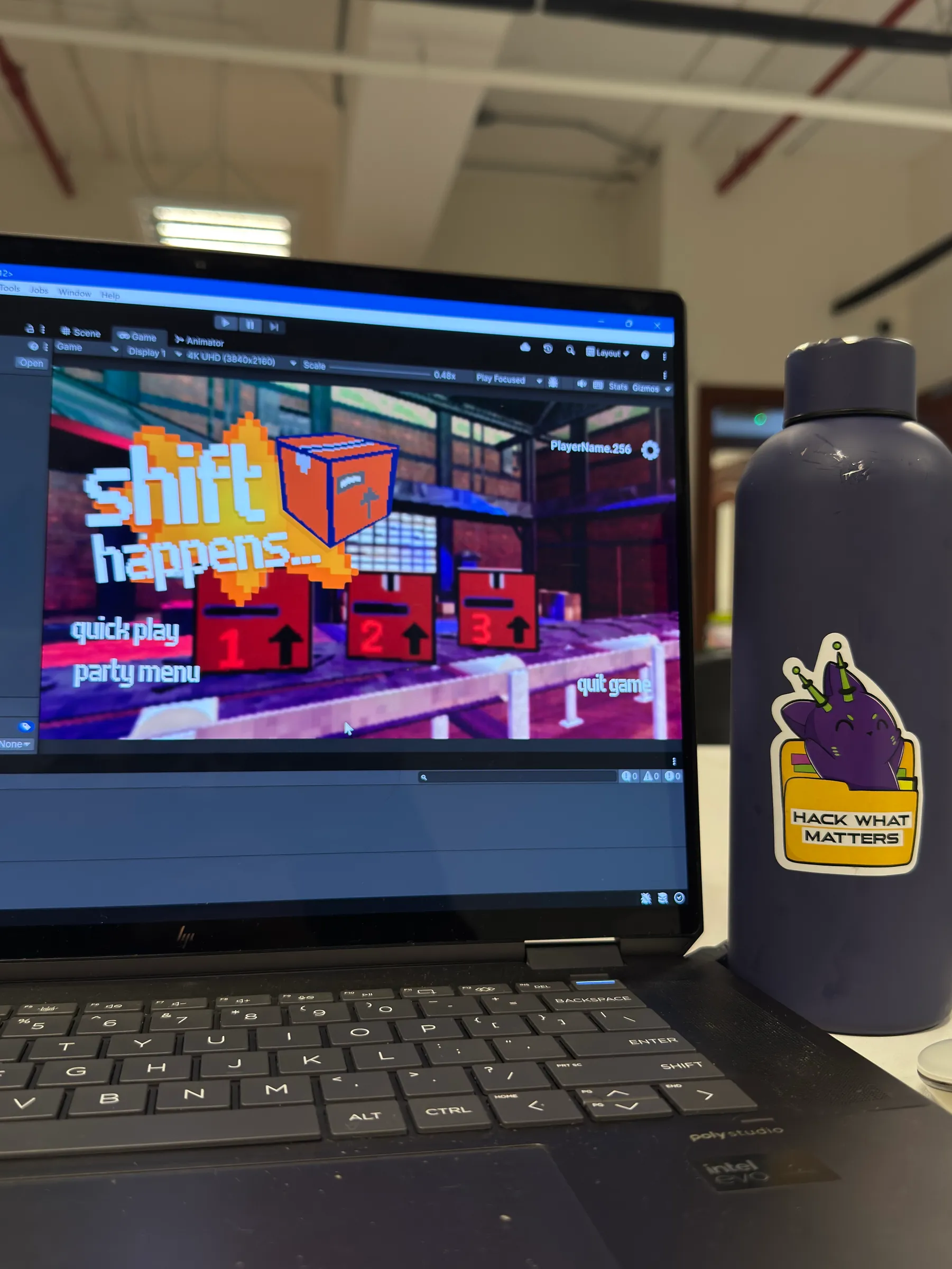 A laptop running a 3D pixel-art modeling tool during the Interact2Hack hackathon