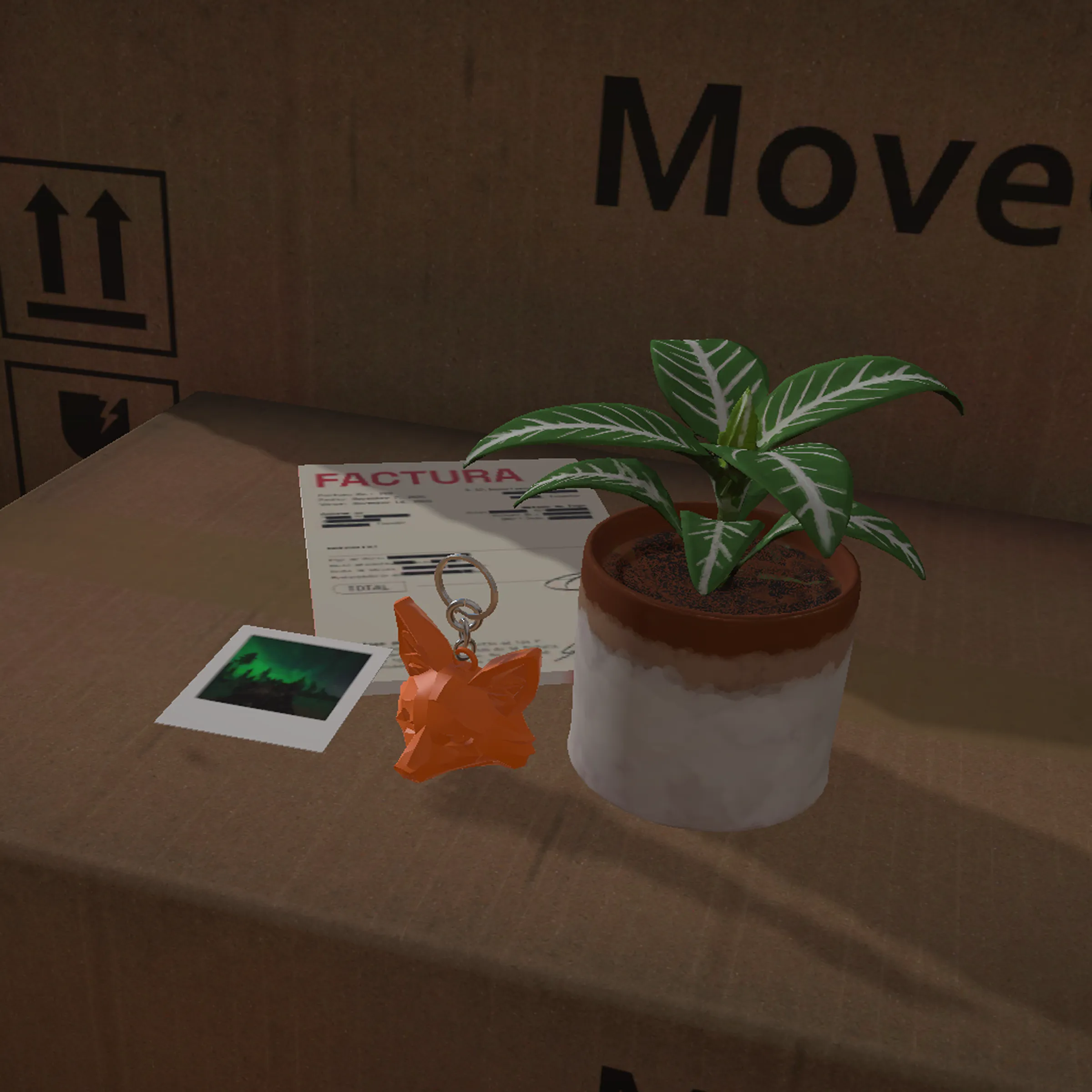 Objects that hold the story: a polaroid, a fox keychain, and a plant over the moving boxes
